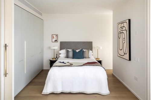 Spare bedroom with neutral interiors in a modern apartment in Canary Wharf, E14