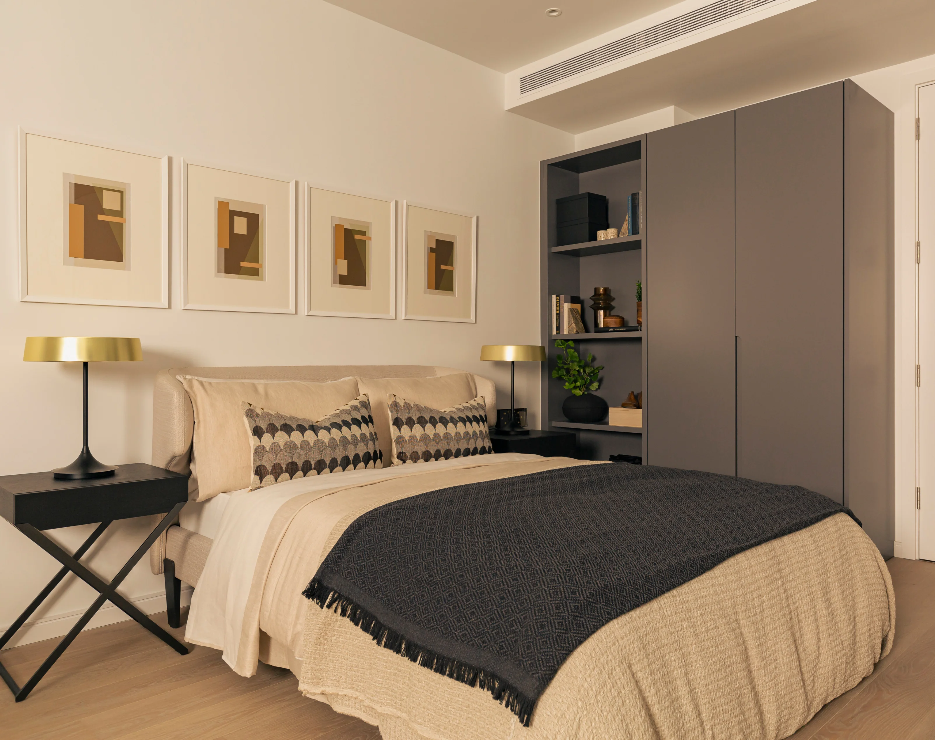 Comfortable bed with bedside table in studio apartment in 10 george street