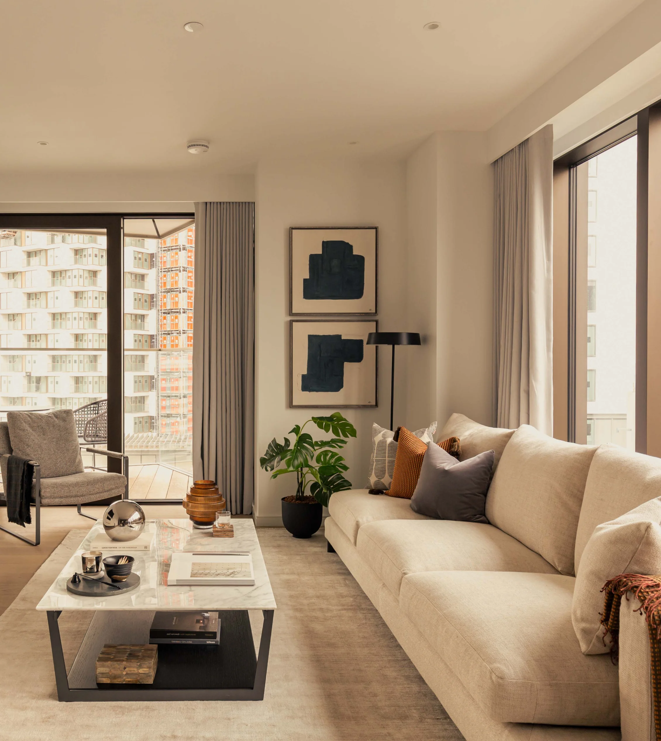 living room area with sofa and balcony in two bedroom apartment in 10 george street