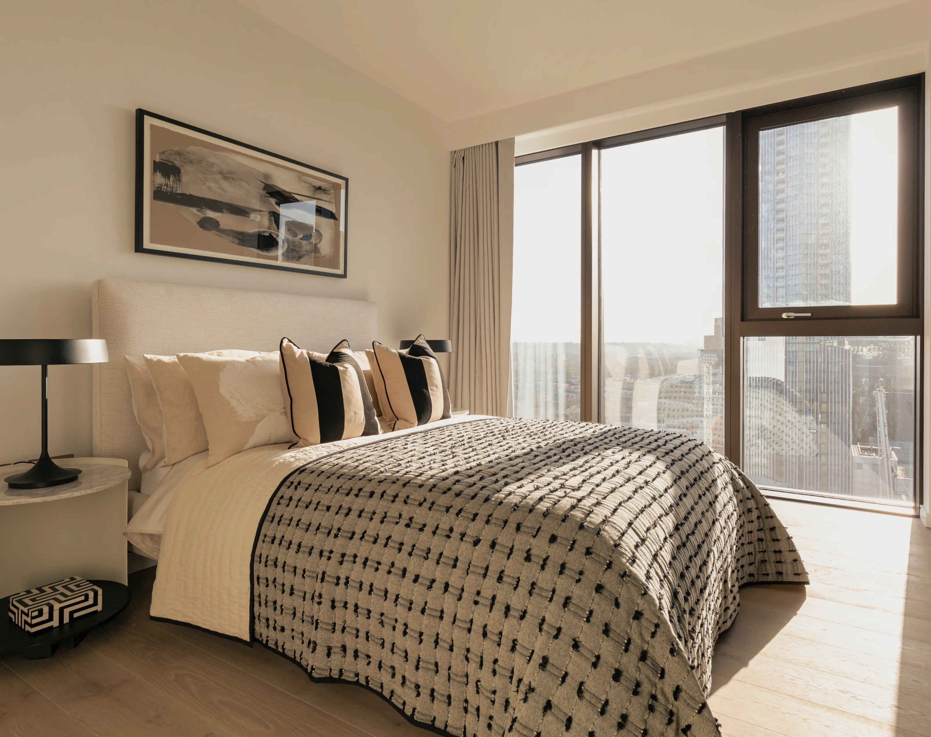 comfortable bed with big windows in 8 water street