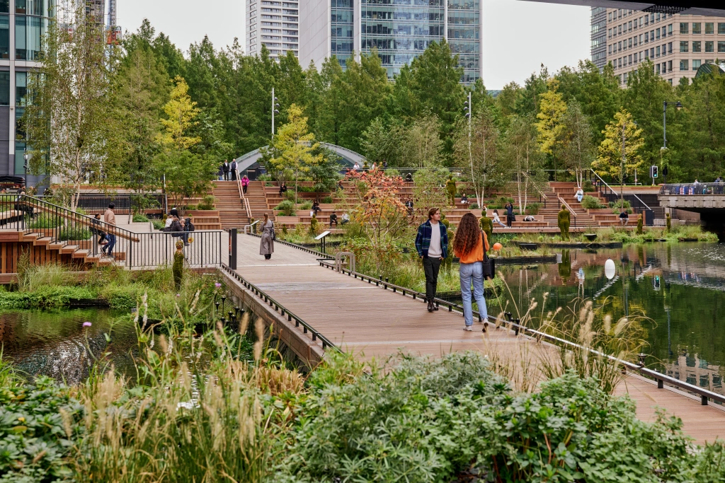 people walking across Eden Dock