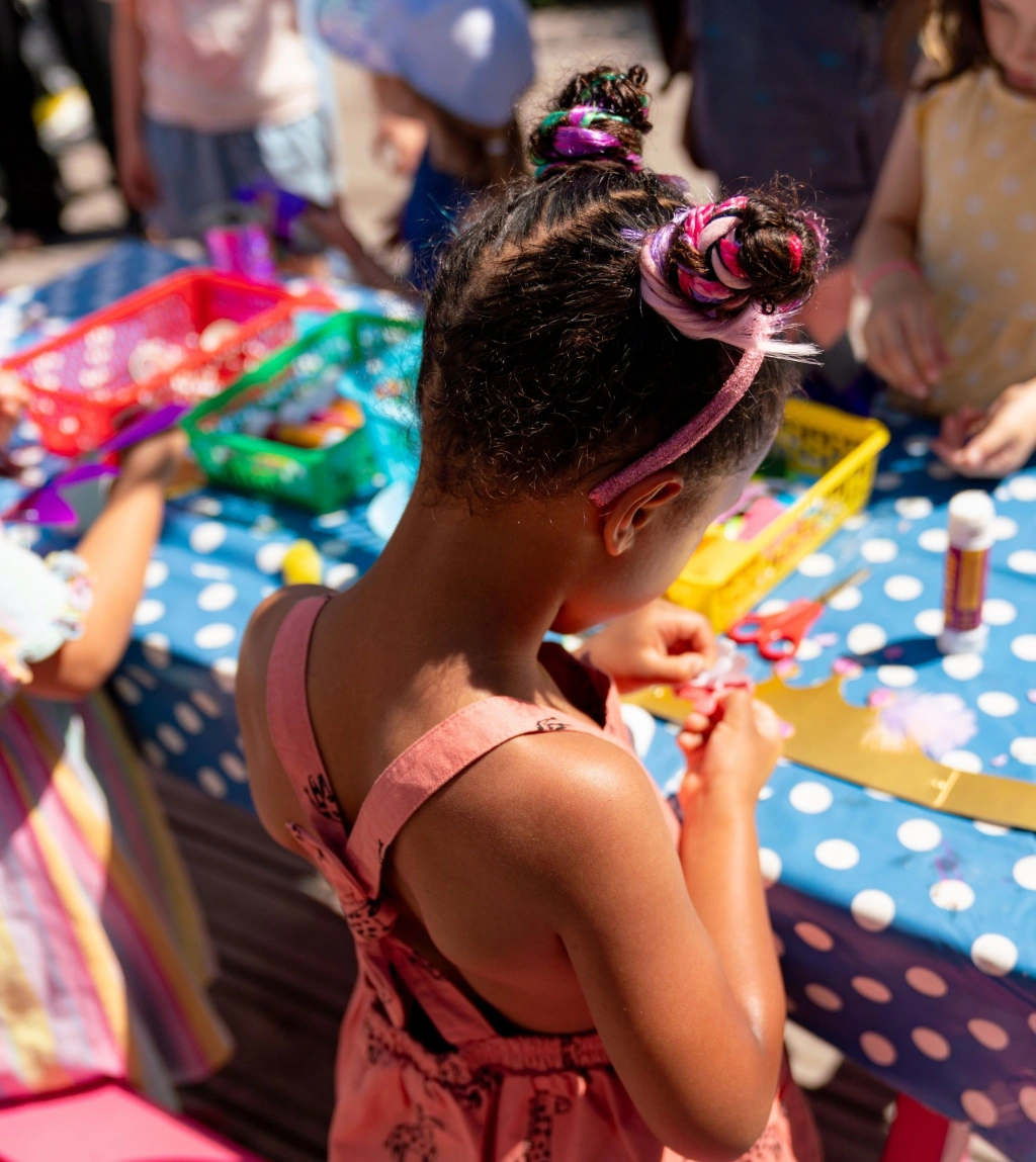children making crafts at local event